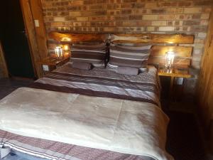Ένα ή περισσότερα κρεβάτια σε δωμάτιο στο Rainbow Lodge