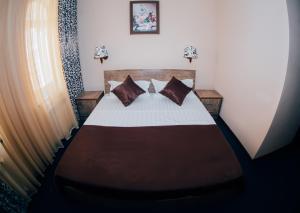 Een bed of bedden in een kamer bij Hotel Bek Samarkand
