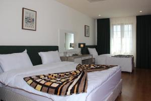 - une chambre d'hôtel avec 2 lits dans l'établissement Khan Saray, à Sulaymaniyah