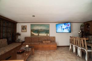 a living room with a couch and a table at Kochili Apartments in Neos Pirgos