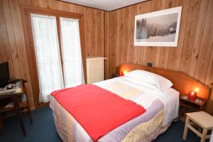 Säng eller sängar i ett rum på Hotel Genzianella