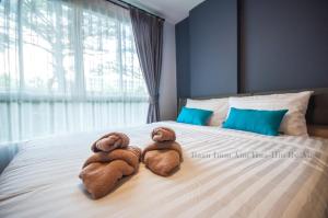 Postel nebo postele na pokoji v ubytování Baan Imm Aim Huahin by Alice