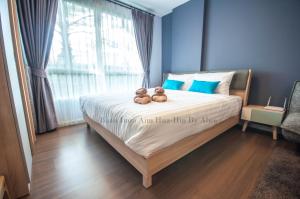 Postel nebo postele na pokoji v ubytování Baan Imm Aim Huahin by Alice