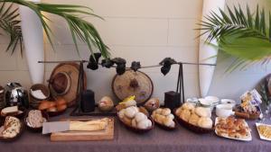 a table topped with lots of different types of bread at Hotel Martinique in Nieuwpoort