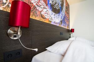 Postel nebo postele na pokoji v ubytování Bastion Hotel Maastricht Centrum