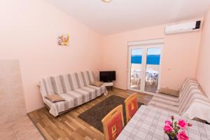 Ein Sitzbereich in der Unterkunft Apartman Anamarija