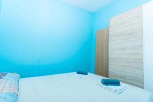 Ein Bett oder Betten in einem Zimmer der Unterkunft Apartman Anamarija