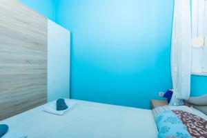 Ein Bett oder Betten in einem Zimmer der Unterkunft Apartman Anamarija