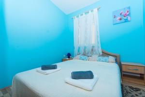 Ein Bett oder Betten in einem Zimmer der Unterkunft Apartman Anamarija