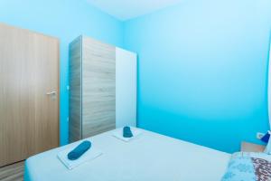 Ein Bett oder Betten in einem Zimmer der Unterkunft Apartman Anamarija
