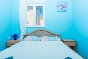 Ein Bett oder Betten in einem Zimmer der Unterkunft Apartman Anamarija