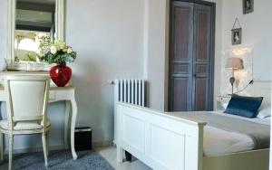 Postel nebo postele na pokoji v ubytování Le Panoramic Boutique Hôtel