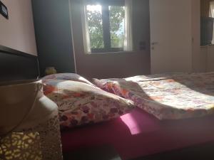 a bedroom with two beds and a window at Villa Markisa in Rukavac +15 photos