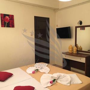 Postel nebo postele na pokoji v ubytování Hotel Karagianni