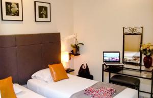 Postel nebo postele na pokoji v ubytování Le Panoramic Boutique Hôtel