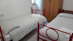Postel nebo postele na pokoji v ubytování Residence Arvinei