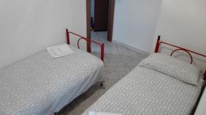 Postel nebo postele na pokoji v ubytování Residence Arvinei