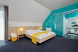 Postel nebo postele na pokoji v ubytování Hotel Garni Colora + 30 fotografií