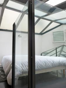 Un ou plusieurs lits dans un hébergement de l'établissement Loft Marais Sébastopol CityCosy