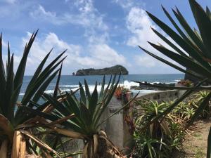 a view of the ocean from the beach at A Villa by the Sea Bed & Breakfast in Vila Franca do Campo