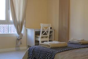 A bed or beds in a room at Disfruta León a pie