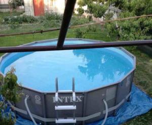a small blue tub sitting in the grass at Old SALONA in Solin