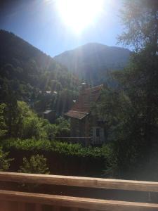 a house in the middle of a mountain at La Ribambelle in Saint-Martin-Vésubie