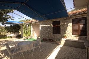 Patio nebo venkovní prostory v ubytování Apartments Cvelic Milovcic