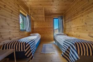 Postel nebo postele na pokoji v ubytování Domki Morskie Tarasy