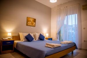 Ένα ή περισσότερα κρεβάτια σε δωμάτιο στο Pantheon Deluxe Apartments