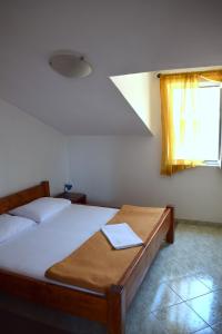 Postel nebo postele na pokoji v ubytování Apartments Matulic
