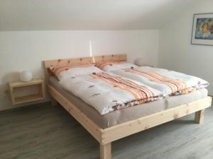 A bed or beds in a room at Familie Seiwald