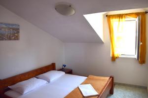 Postel nebo postele na pokoji v ubytování Apartments Matulic