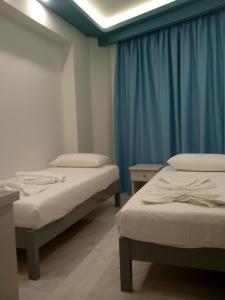 Voodi või voodid majutusasutuse Callinica Hotel toas