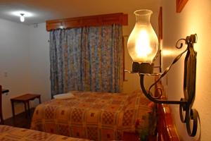 Postel nebo postele na pokoji v ubytování Hotel San Luis