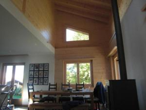 a room with a table and chairs and a window at Chalet Griffon in Nendaz