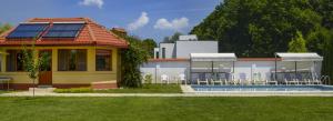 a house with solar panels on top of it at Vila Maria Snagov in Snagov