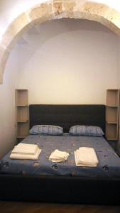 NovoliにあるSalento's Casettinaのベッド1台(枕2つ、タオル付)