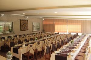 a large banquet hall with tables and chairs in it at Hotel San Carlo in Coirón