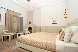 Postel nebo postele na pokoji v ubytování Riad 64 Maison D'hôtes & Spa
