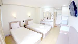 Voodi või voodid majutusasutuse P.A. Place Hotel toas