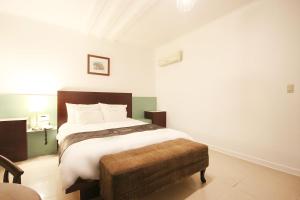 Postelja oz. postelje v sobi nastanitve Charmant Hotel