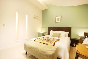 Postelja oz. postelje v sobi nastanitve Charmant Hotel