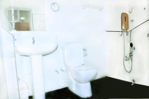 Koupelna v ubytování Bon Voyaage Tourist Inn