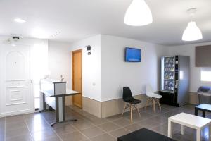 a room with a kitchen with a table and chairs at Tere Playa in Burriana