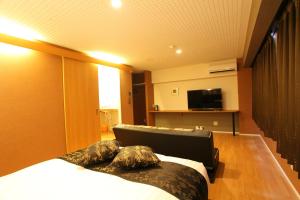 TV a/nebo společenská místnost v ubytování Town Hotel 41