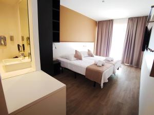 Ein Bett oder Betten in einem Zimmer der Unterkunft Planet Hotels ONE - Adults Only 16 years