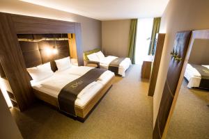 Postel nebo postele na pokoji v ubytování RiKu HOTEL Ulm