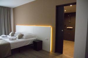 Ein Bett oder Betten in einem Zimmer der Unterkunft Planet Hotels ONE - Adults Only 16 years