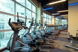 a row of exercise bikes in a gym at LIDO FORESTRY SPA RESORT in Yangmei